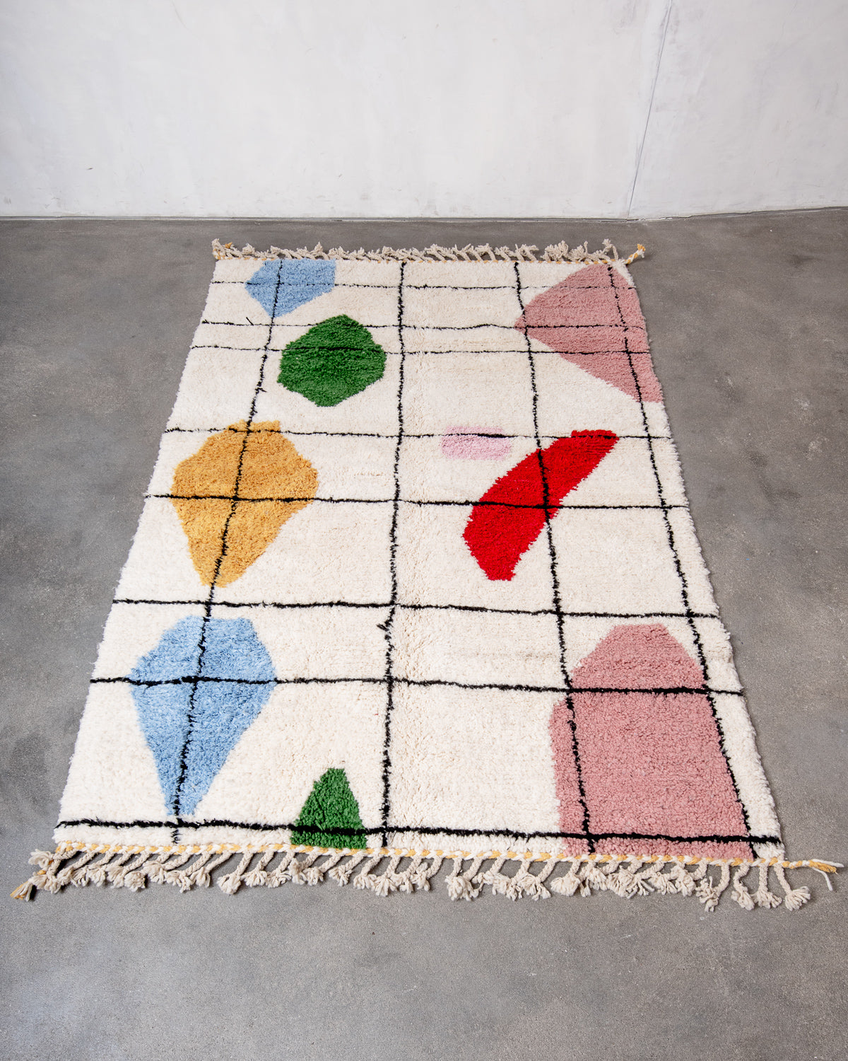 Modern, designer, handcrafted Berber rug from Morocco. Beniourain carpet with beautiful colours and patterns and fluffy wool texture.
